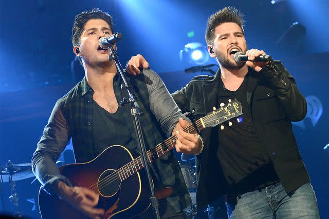 <p>Rick Diamond/Getty Images</p> Dan + Shay performs in Texas in March 2014