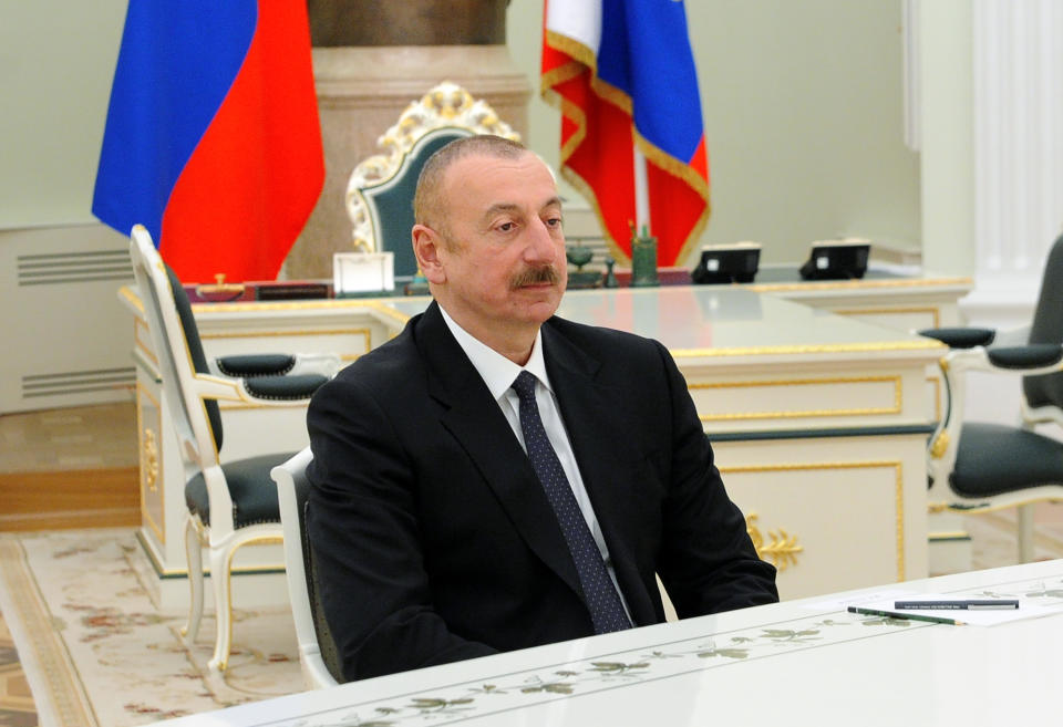 Azerbaijan's President Ilham Aliyev attends a meeting with Russian President Vladimir Putin and Armenian Prime Minister Nikol Pashinyan in Kremlin in Moscow, Russia, Monday, Jan. 11, 2021. Russian President Vladimir Putin on Monday hosted his counterparts from Armenia and Azerbaijan, their first meeting since a Russia-brokered truce ended six weeks of fighting over Nagorno-Karabakh. (Mikhail Klimentyev, Sputnik, Kremlin Pool Photo via AP)