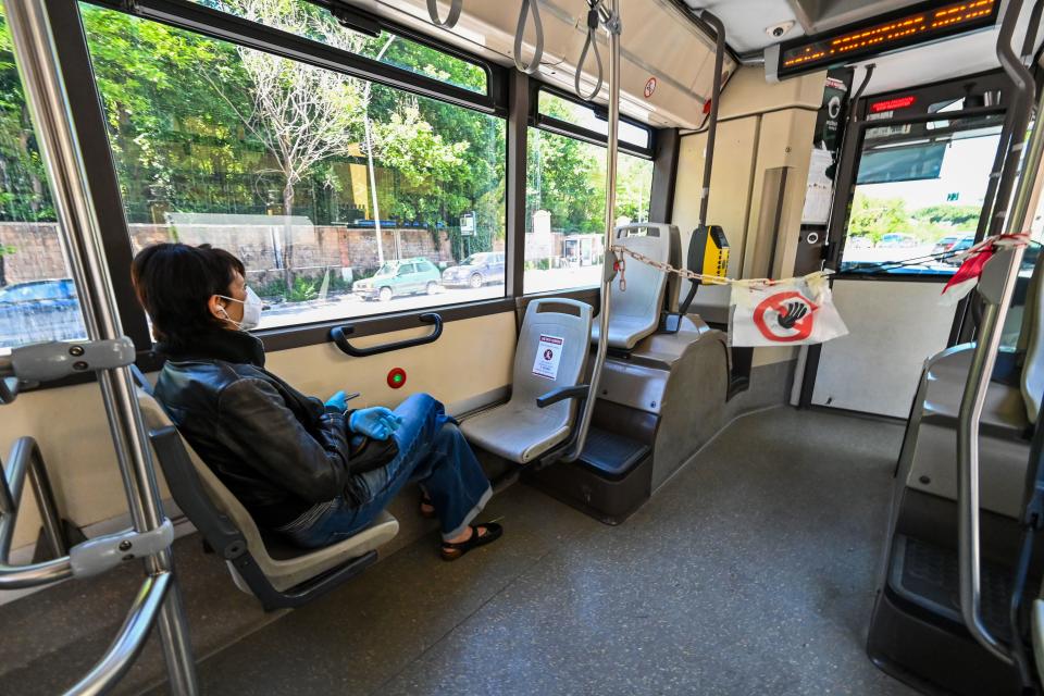 A chain and a sign forbidding access to the front of the vehicle and the driver's area is pictured in a public transport bus in Rome Monday.