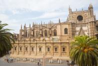 <p>Seville Cathedral is the largest Gothic edifice in the world, reflecting the country's Golden Age of colonization in the New World, Islamic influence, and religious power. Built on top of a former mosque, construction on this behemoth began at the turn of the 15th century and spanned seven centuries. Its strong ties to New World discovery makes it a natural home for many of the early explorers' precious documents, and it's even the site of Christopher Columbus's tomb.</p>