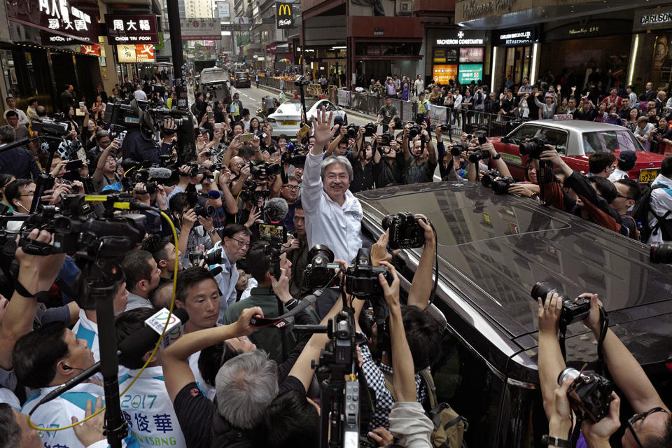 John Tsang waves to supporters in Hong Kong