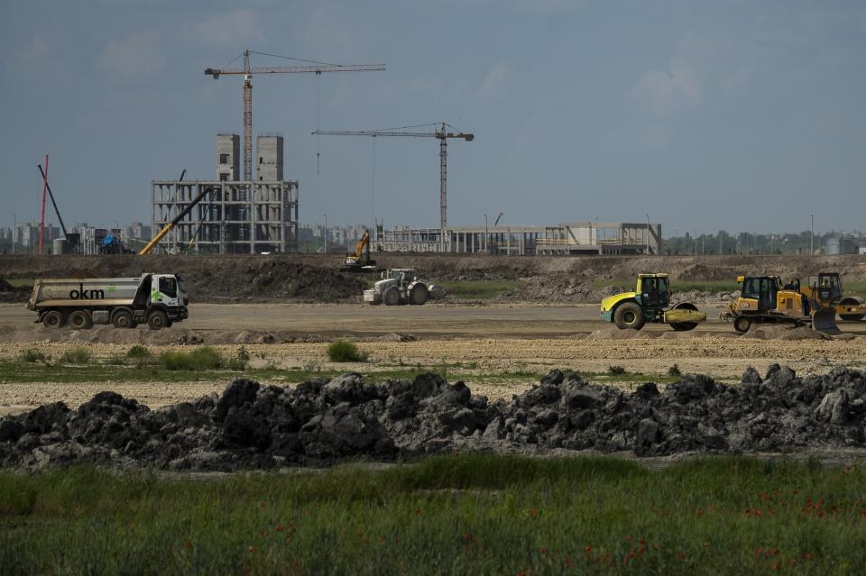 FILE- Construction is underway for a battery factory for electric vehicles built by China-based Contemporary Amperex Technology Co. Limited (CATL) in Debrecen, Hungary on Tuesday, May 23, 2023. Hungary's government has deepened its economic ties with China, with the proliferation of Chinese electric vehicle (EV) battery factories across the country gaining the most attention. Near Debrecen, construction is underway of a nearly 550-acre, 7.3 billion euro ($7.9 billion) EV battery plant, Hungary's largest-ever foreign direct investment. (AP Photo/Denes Erdos, File)