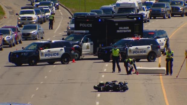 Police received reports that the rider of the motorcycle was knocked off his bike by a mattress that fell off a truck. (Scott Neufeld/CBC - image credit)