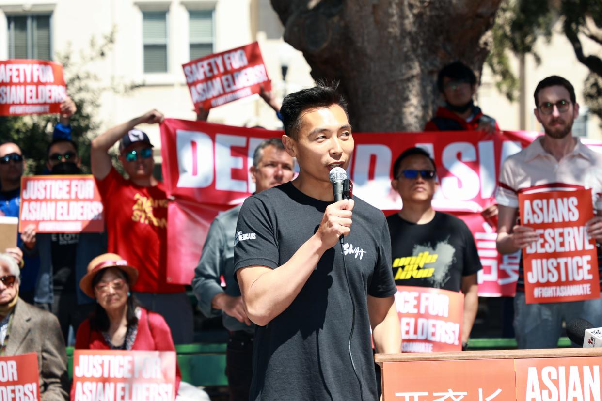 Justin Zhu, co-founder and executive director of Stand with Asian Americans, spoke at a rally in response to Asian elder violence in San Francisco. Such incidents spiked during the COVID-19 pandemic, fed by anti-Asian rhetoric.