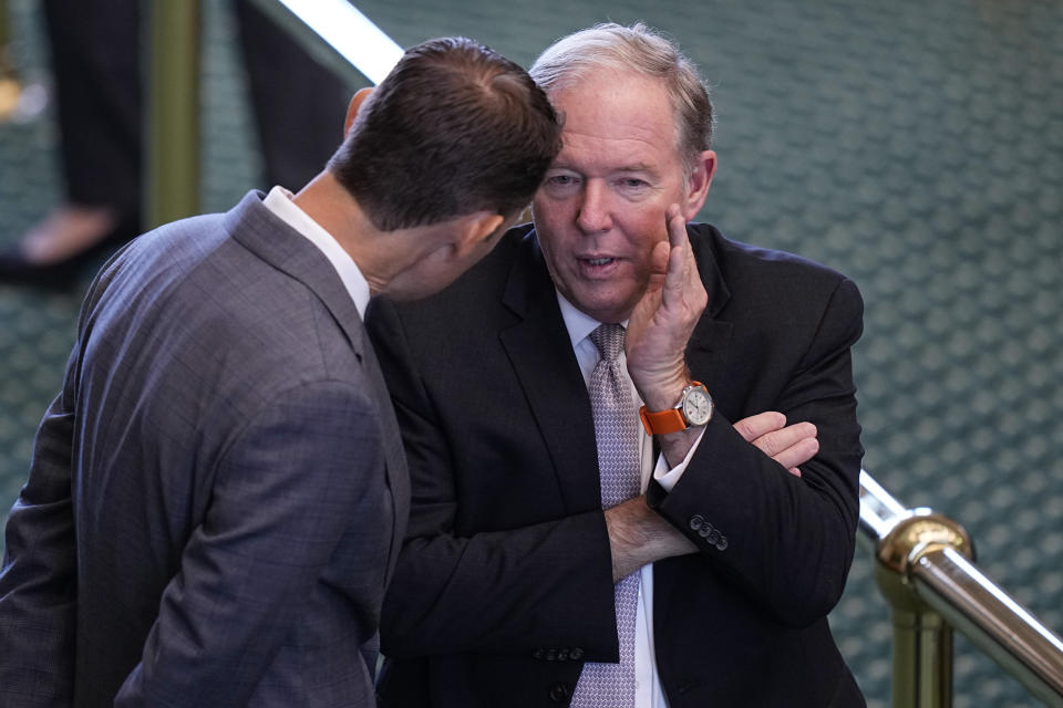 Attorney Johnny Sutton, right, talks with whistleblower witness Ryan Bangert during a break in day three of the impeachment trial for Texas Attorney General Ken Paxton in the Senate Chamber at the Texas Capitol, Thursday, Sept. 7, 2023, in Austin, Texas. (AP Photo/Eric Gay)