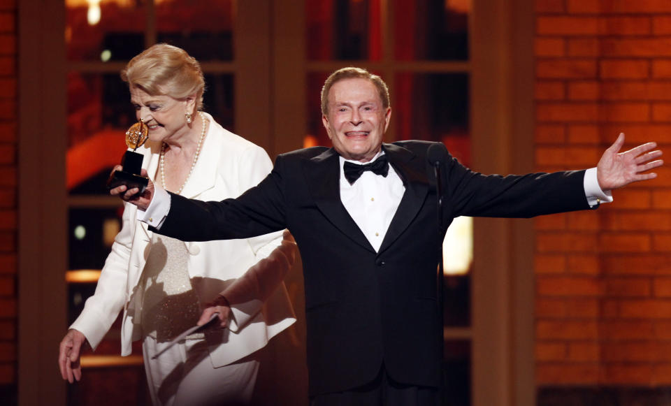 FILE - In this June 7, 2009, file photo, Jerry Herman accepts his Special Tony Award for Lifetime Achievement in the Theater from Angela Lansbury at the 63rd Annual Tony Awards in New York. Herman, the award winning composer who wrote the cheerful, good-natured music and lyrics for such classic shows as "Mame," "Hello, Dolly!" and "La Cage aux Folles," has died. He was 88. (AP Photo/Seth Wenig, FILE)