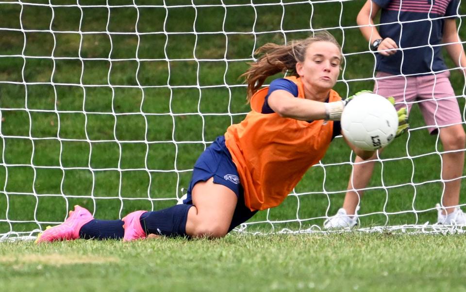 Cape Cod Academy goalie Lili Shanahan deflects an Upper Cape Tech shot.