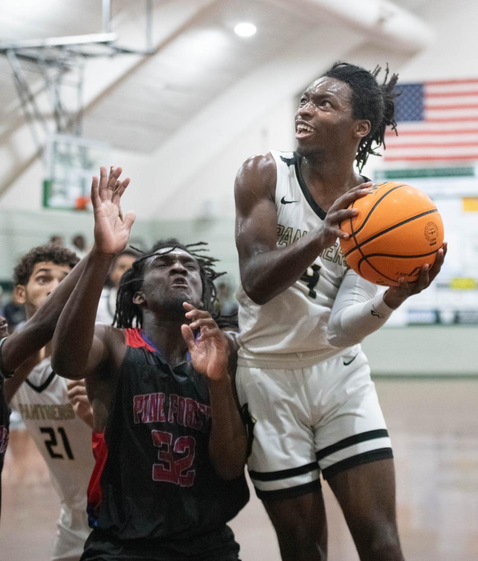 Treymar Jones (4) looks to shoot during the Pine Forest vs Milton high school basketball game in the Esca-Rosa Challenge at Pensacola Catholic High School on Tuesday, Nov. 21, 2023.