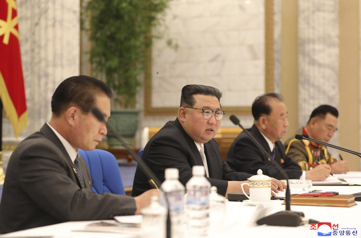 In this photo provided by the North Korean government, North Korean leader Kim Jong Un, center, attends a meeting of the Central Military Commission of the ruling Workers' Party, which were held between June 21 and 23, 2022, in Pyongyang, North Korea. Independent journalists were not given access to cover the event depicted in this image distributed by the North Korean government. The content of this image is as provided and cannot be independently verified. Korean language watermark on image as provided by source reads: "KCNA" which is the abbreviation for Korean Central News Agency. (Korean Central News Agency/Korea News Service via AP)