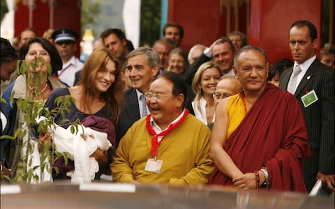 Carla Bruni-Sarkozy with Sogyal at the opening of the Lerab Ling Temple On August 22, 2008 - Credit: Getty Images