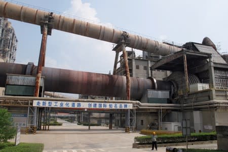 Worker is seen at an Anhui Conch cement plant in Tongling