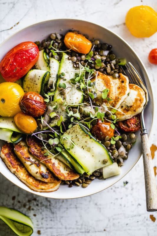 <p>The Almond Eater</p><p>This halloumi lentil salad is made with cooked lentils, roasted tomatoes, zucchini and fried halloumi. It’s a fresh, vegetarian lunch option topped with a simple avocado dressing.</p><p><strong>Get the recipe: <a href="https://thealmondeater.com/fried-halloumi-lentil-salad/" rel="nofollow noopener" target="_blank" data-ylk="slk:Fried Halloumi Lentil Salad;elm:context_link;itc:0;sec:content-canvas" class="link ">Fried Halloumi Lentil Salad</a></strong></p>