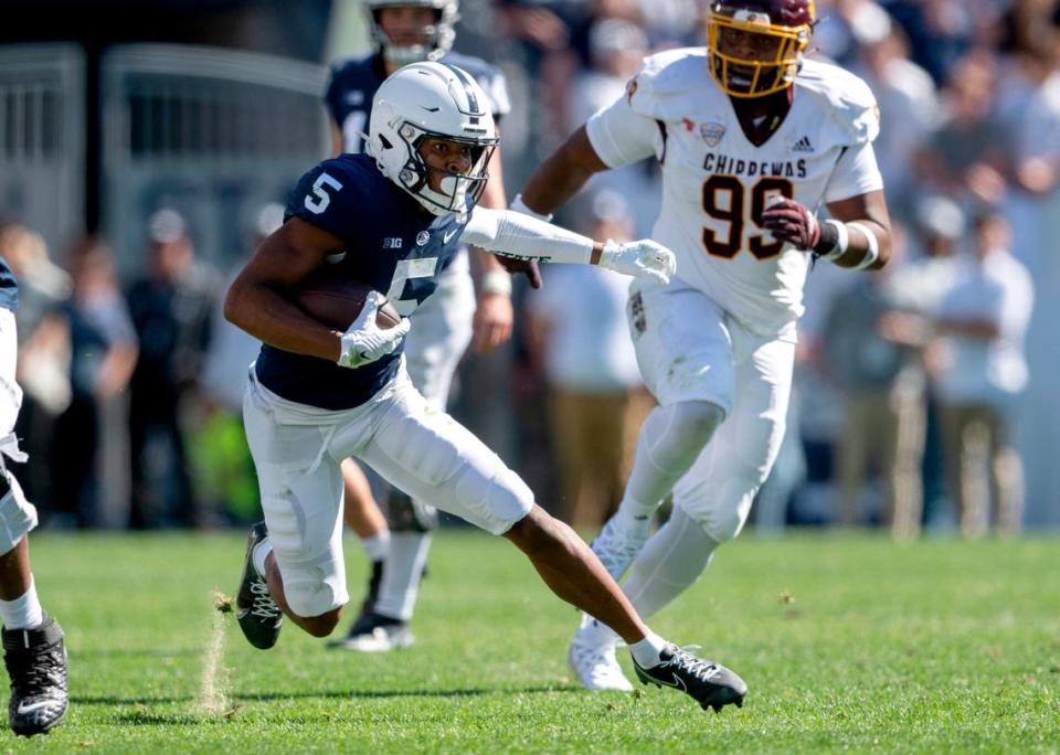 Penn State wide receiver Mitchell Tinsley cuts down the field with the ball from Central Michigan defenders during the game on Saturday, Sept. 24, 2022.