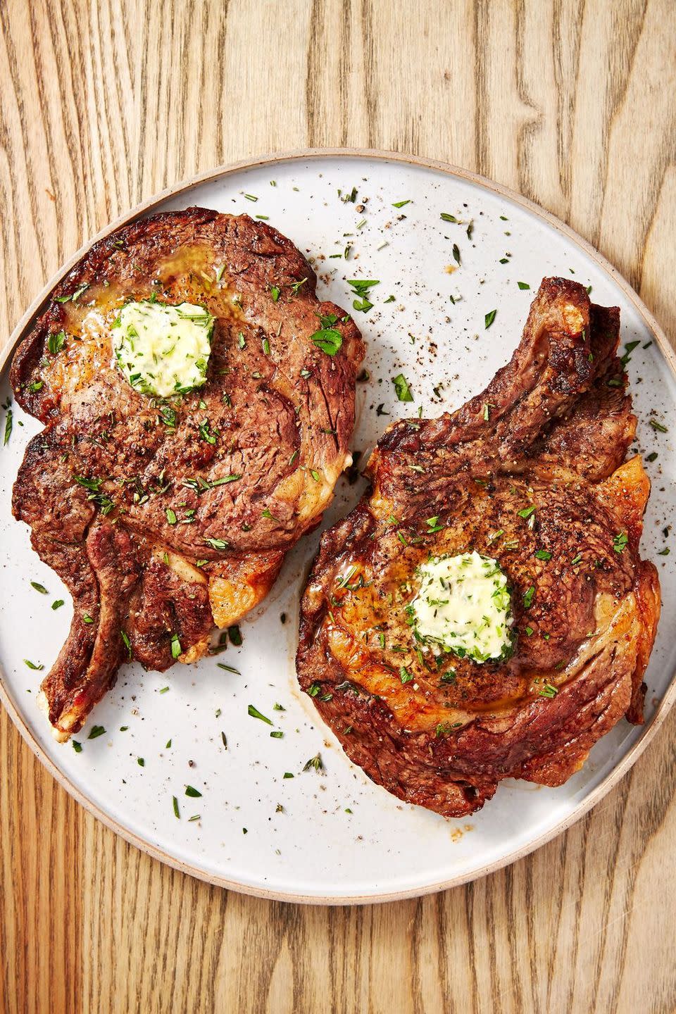 <p>A <a href="https://www.delish.com/uk/cooking/recipes/a30252481/how-to-pan-fry-steak/" rel="nofollow noopener" target="_blank" data-ylk="slk:perfectly seared steak" class="link ">perfectly seared steak</a> can seem like a daunting task. Getting the golden, crusty sear on the outside and trying not to overcook your steak can be difficult. </p><p>What if we told you that your air fryer can take all of that stress away? It's true! Leave it to the air fryer to cook a perfect piece of steak all without filling your kitchen with smoke or turning on the grill. As for the herb butter? It's not mandatory, but it sure is delicious. </p><p>Get the <a href="https://www.delish.com/uk/cooking/recipes/a32284104/air-fryer-steak-recipe/" rel="nofollow noopener" target="_blank" data-ylk="slk:Air Fryer Steak" class="link ">Air Fryer Steak</a> recipe.</p>