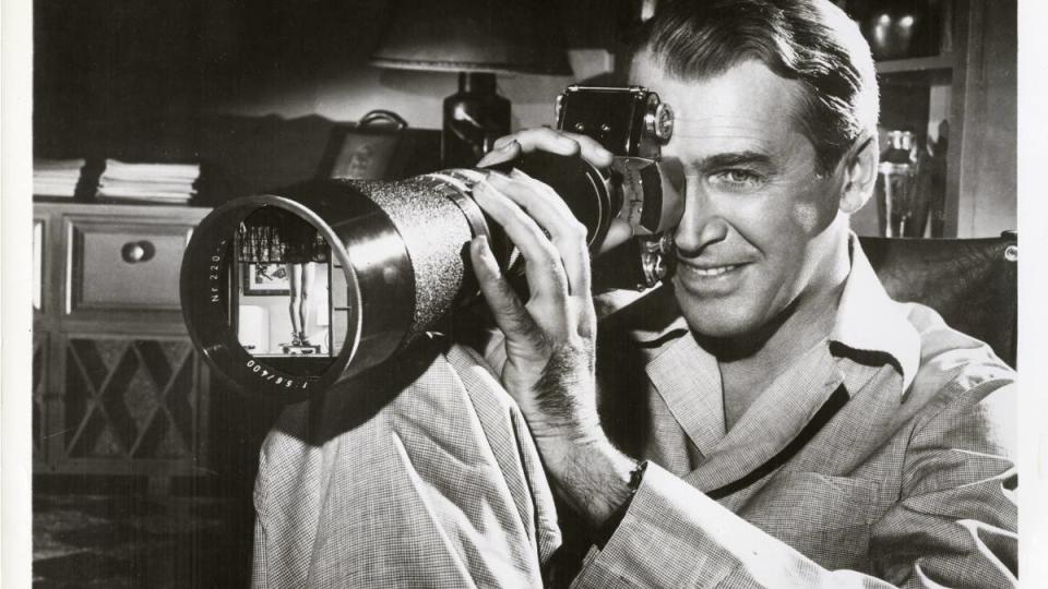 Man holding a camera in “Rear Window”