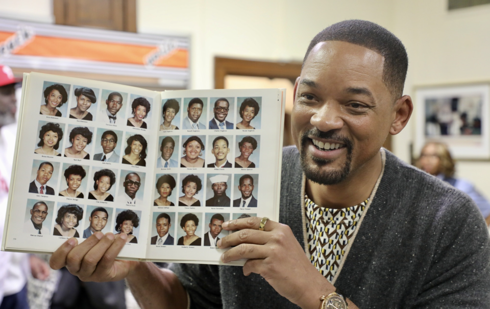 Will Smith looked at his old yearbook while visiting his Philadelphia high school on Thursday. (Photo: Philadelphia Schools via Facebook)