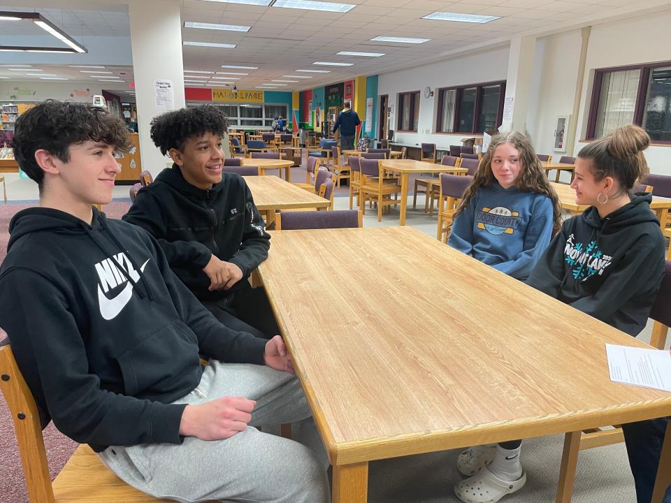 Jadon Chiyangwa, 14, back left, Tate Savides,14, front left, Addison Kiekhaefer, 13, back right, and Emma Mineau, 13, front right, discuss their roles as Sources of Strength leaders at James Madison Middle School on Feb. 5 in Appleton. They help their peers open up about struggles in sports, academics, relationships and more.