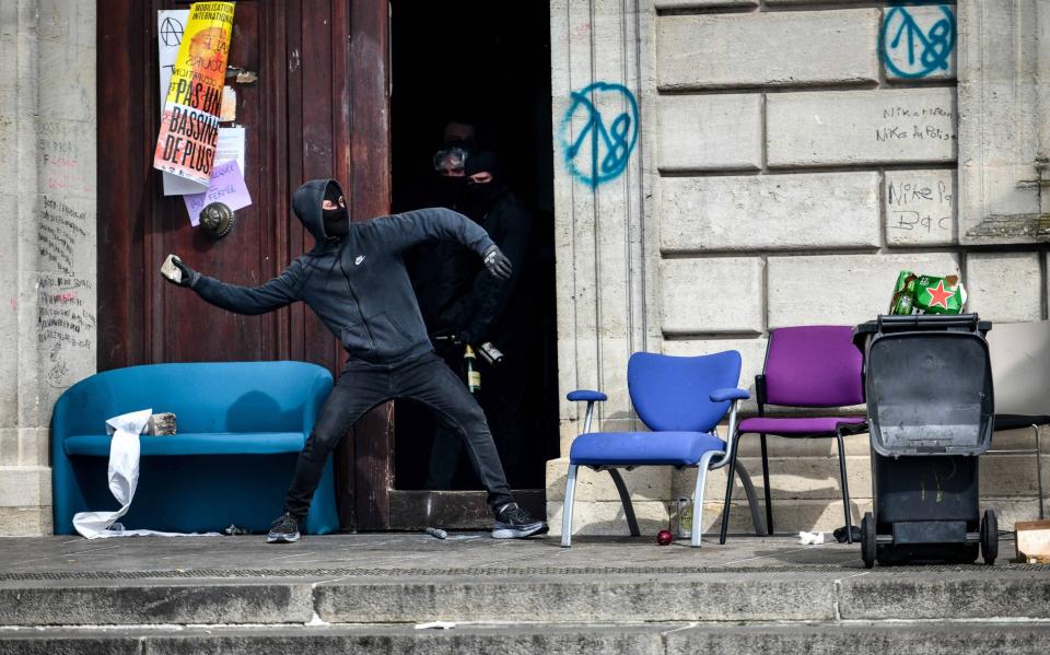 Demonstrators throw projectiles on the Anti Riot Police Front of Bordeaux Victoire - UGO AMEZ/SIPA/Shutterstock