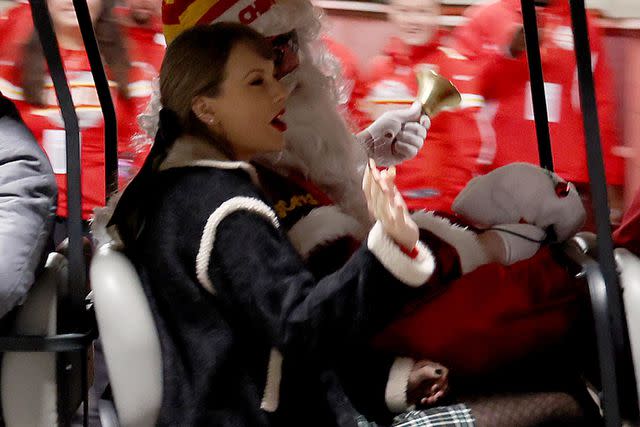 <p>Jamie Squire/Getty</p> Taylor Swift waves to fans at Chiefs vs. Raiders game on Dec. 25