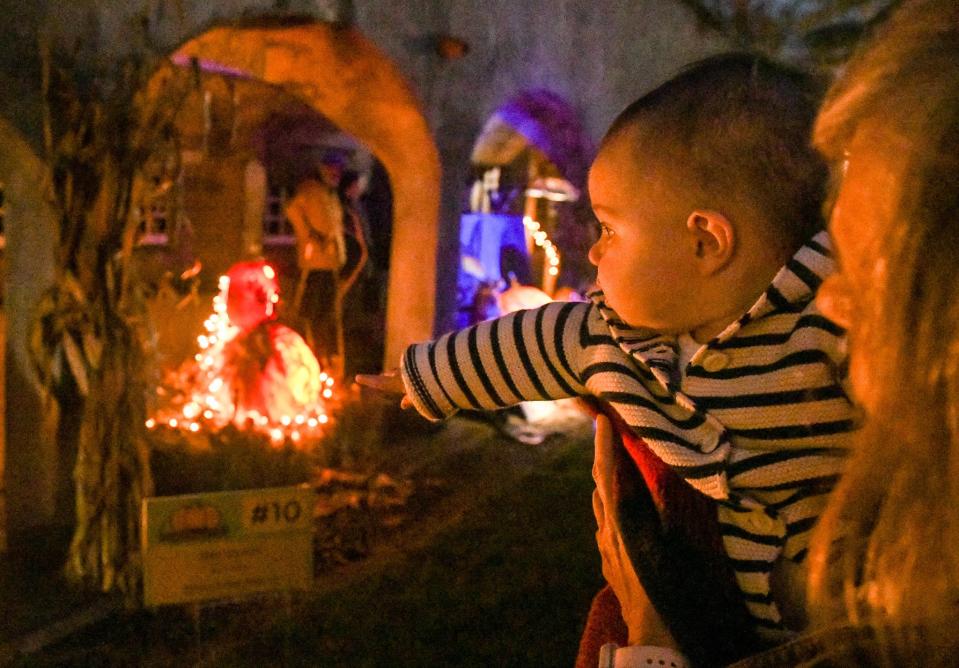 Hundreds lined up to get a view of gigantic carved pumpkins beneath the historic arches of the Bucks County Tile Works Oct. 23 during the 2021 Pumpkinfest.