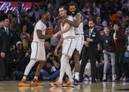 Mar 17, 2019; New York, NY, USA; New York Knicks guard Emmanuel Mudiay (1), forward Mario Hezonja (8) and center DeAndre Jordan (6) celebrate the Knicks 124-123 victory over the Los Angeles Lakers at Madison Square Garden. Mandatory Credit: Wendell Cruz-USA TODAY Sports