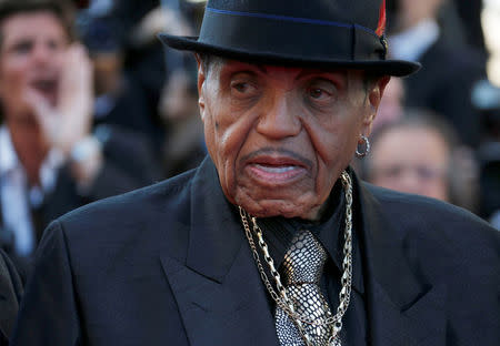 Joe Jackson, father of the late pop star Michael Jackson, poses on the red carpet as he arrives for the screening of the film "Sils Maria" (Clouds of Sils Maria) in competition at the 67th Cannes Film Festival in Cannes, France, May 23, 2014. REUTERS/Regis Duvignau/Files