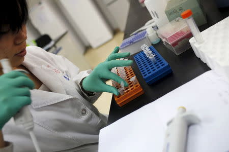 A researcher prepares medicine at a laboratory in Nanjing University in Nanjing, Jiangsu province, China, in this April 29, 2011 file photo. REUTERS/Aly Song/Files