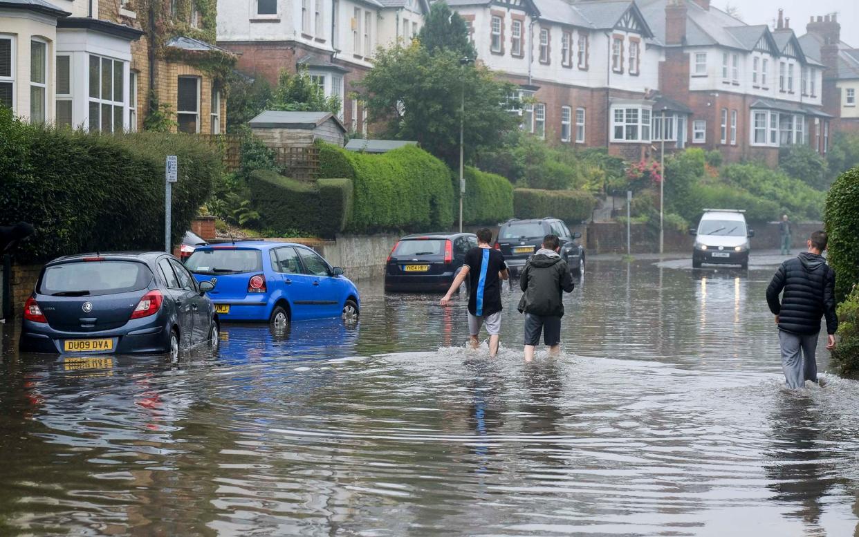 Heavy rain causes flooding in the seaside resort of Scarborough, North Yorkshire - TONY BARTHOLOMEW