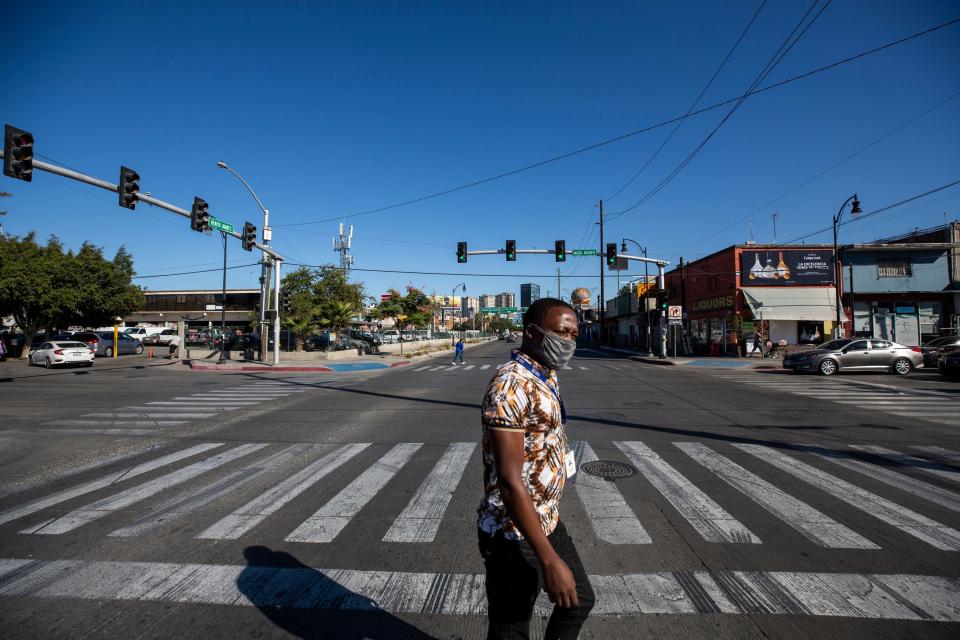 Haitian John Lafontant, 33, hoped he would be given a chance to cross into the United States. Instead, he finds himself in Tijuana, Mexico. In this Nov. 13, 2021, photo Lafontant walks in Downtown Tijuana.