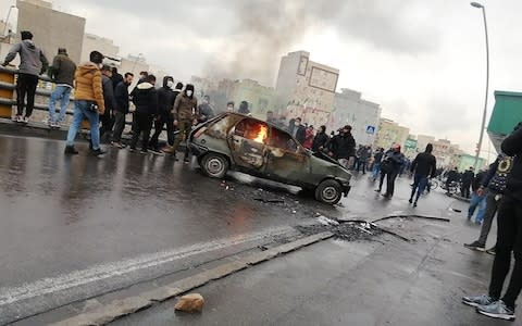 Protesters in Tehran - Credit: Photo by -/AFP via Getty Images