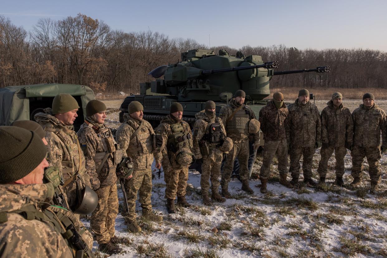 Ukrainian servicemen of a drone hunting team gather next to German Gepard anti-aircraft-gun tank  that is used to target Russian launched drones, in the outskirts of Kyiv, on November 30, 2023, amid the Russian invasion of Ukraine. (AFP via Getty Images)