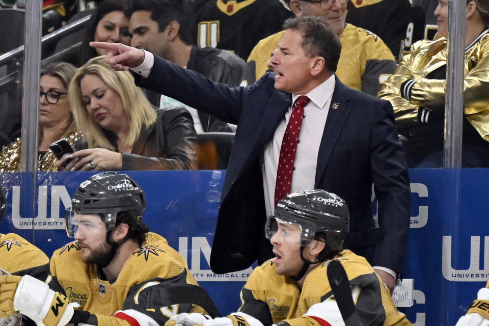 Vegas Golden Knights coach Bruce Cassidy, top right, shouts during the second period of an NHL hockey game against the Dallas Stars, Saturday, Feb. 25, 2023, in Las Vegas. (AP Photo/David Becker)