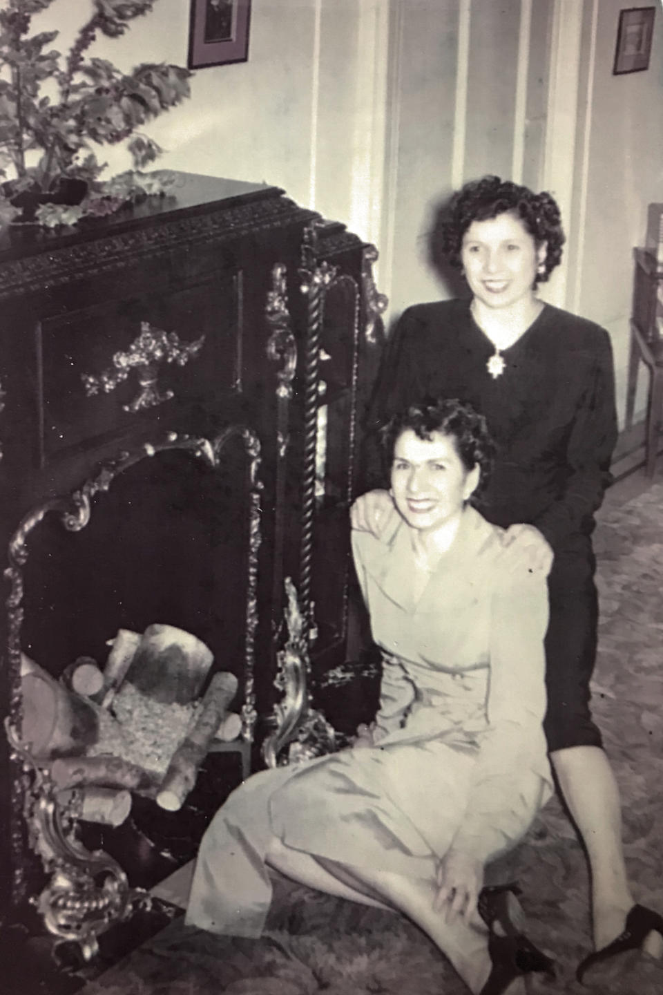 This undated photo provided by her family in May 2020 shows Phyllis Pirro, foreground, and her sister, Mary, in New York. Phyllis Antonetz died of COVID-19 at 103 on April 17, 2020. (Family photo via AP)