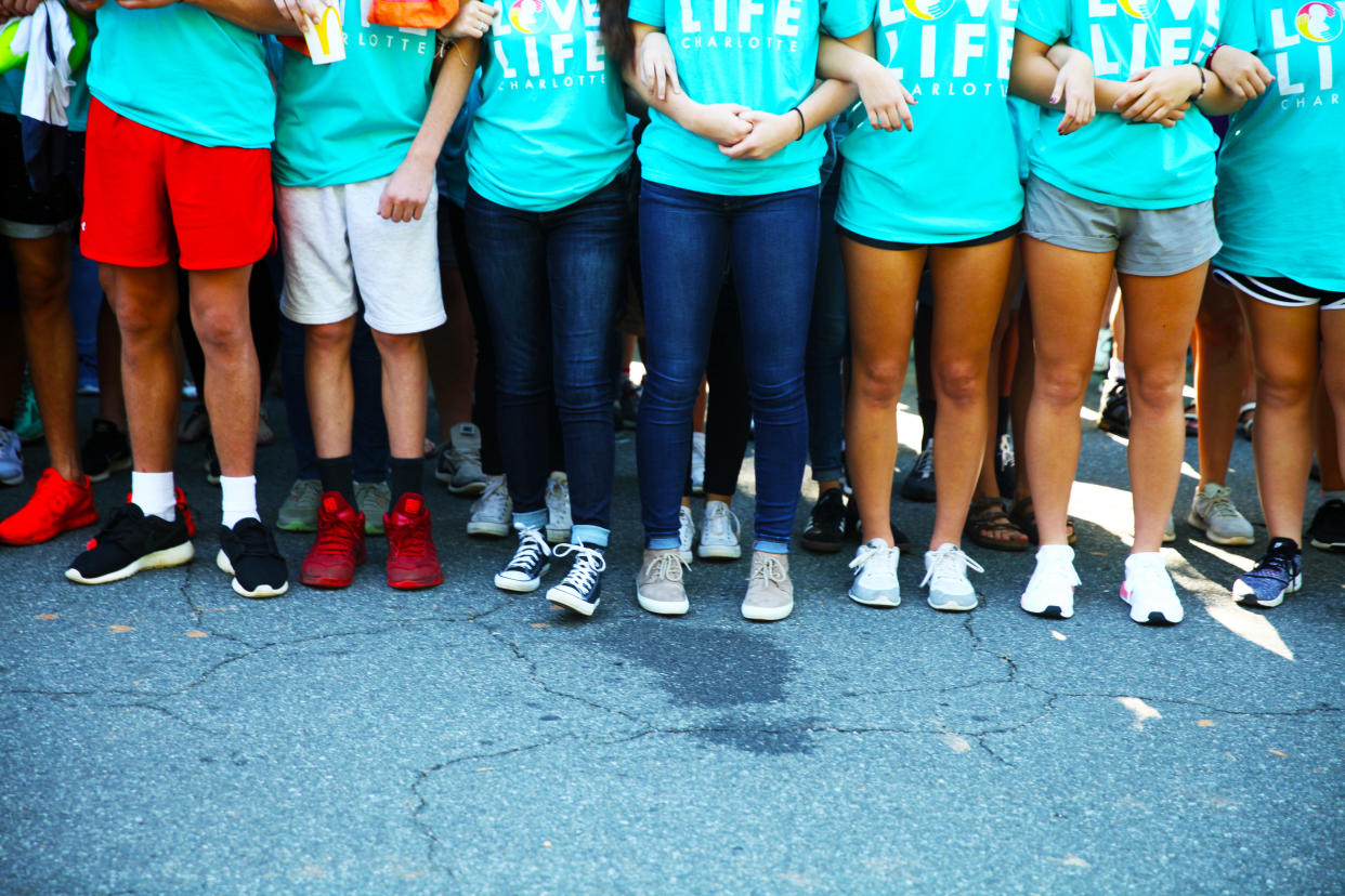 Kids link arms outside A Preferred Women's Health Center in Charlotte to protest abortion access.&nbsp;