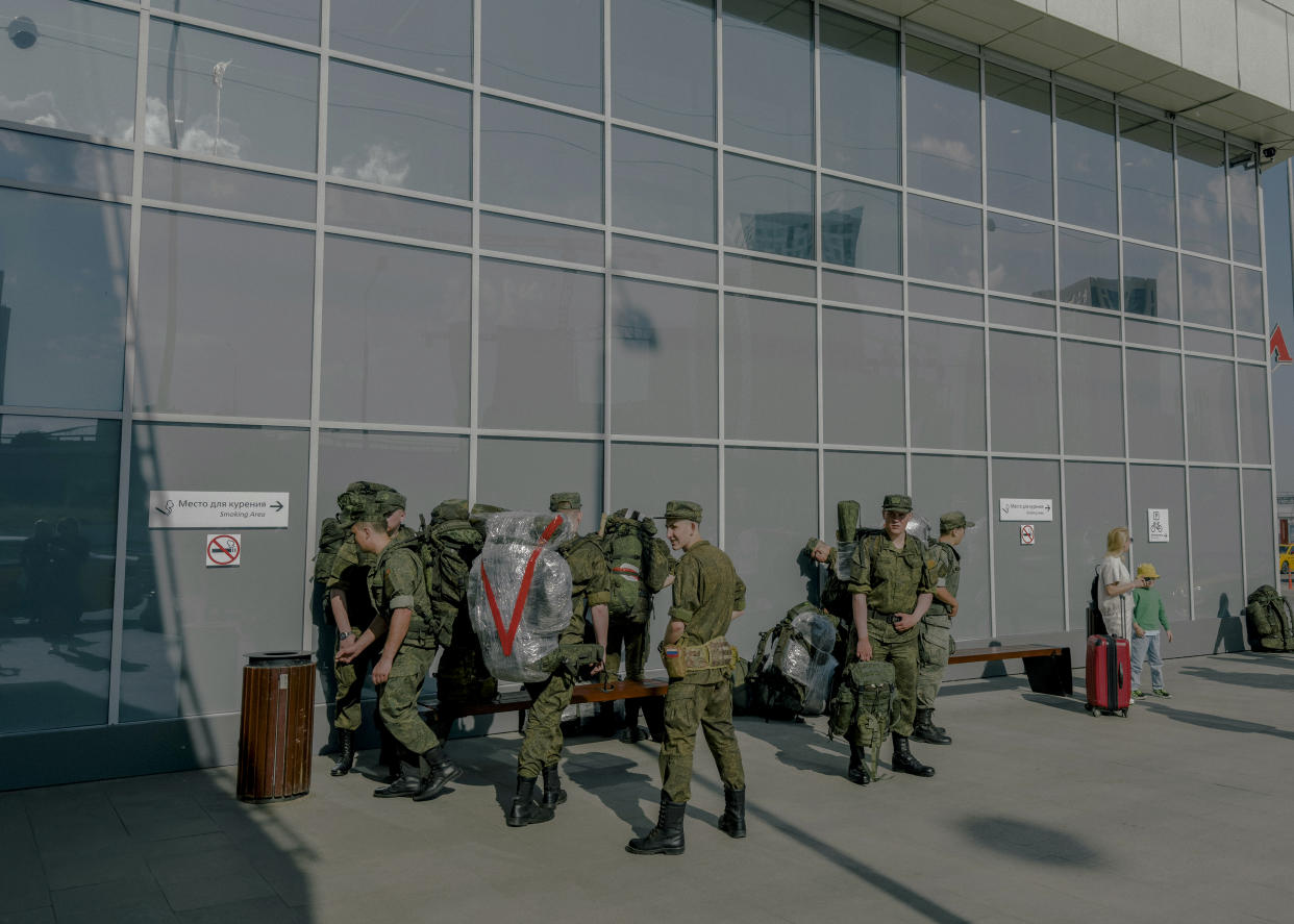 Soldiers outside a railway station in Moscow, on June 9, 2023. (Nanna Heitmann/The New York Times)