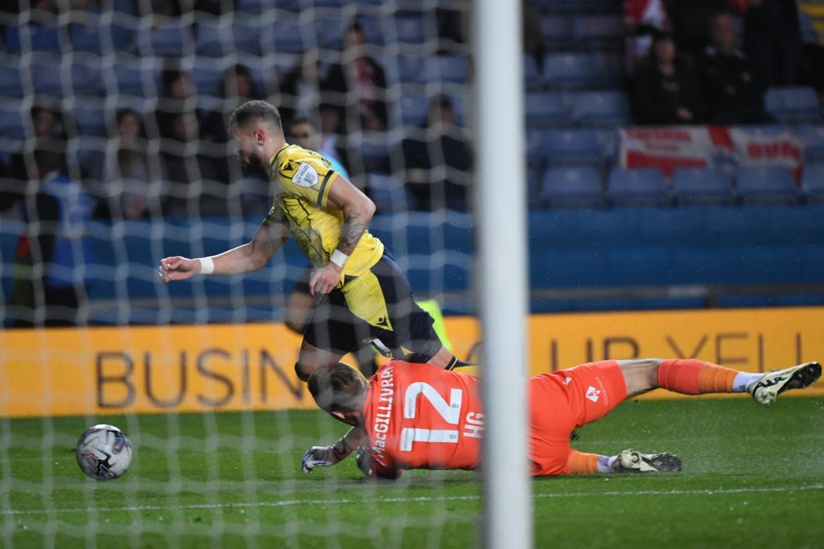 Craig MacGillivray makes contact with Marcus Browne in the first half <i>(Image: Mike Allen)</i>