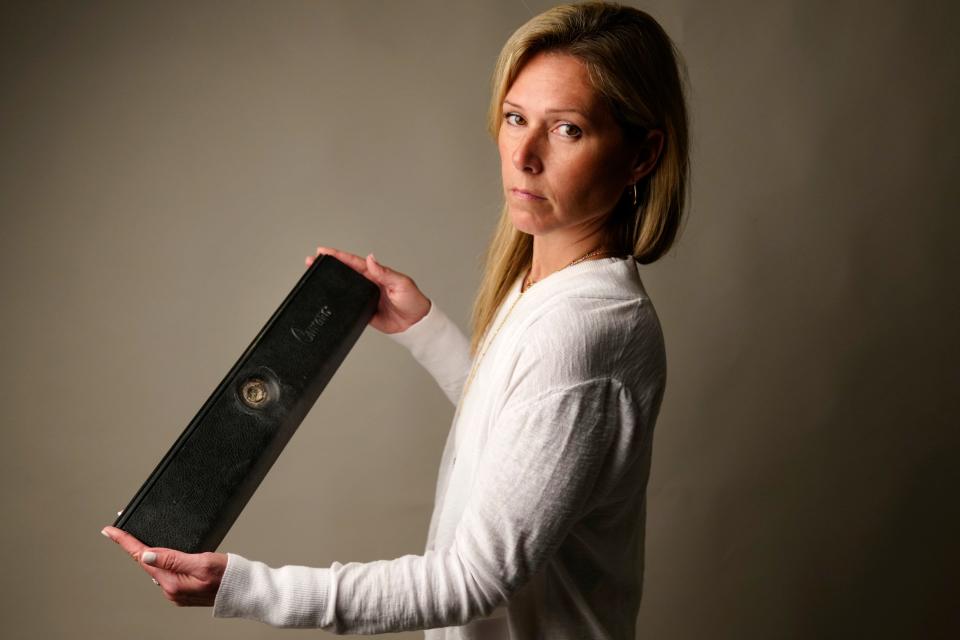 Joanna O'Toole, poses for a photograph as she holds the glove box door of her uncleÕs 1974 Camaro, Monday, July 22, 2024. OÕTooleÕs uncle, Charles Murphy went missing in 1982. She was four years-old at the time of his disappearance and has no memory of her uncle but has vivid memories of decades of anguish it caused her parents. In May of this year, her uncle and his 1974 Camaro were found in the Hackensack River. Although she grew up thinking his disappearance was due to a fatal accident, she no longer believes it was an accident.