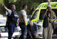FILE - In this March 15, 2019, file photo, police attempt to clear people from outside a mosque in central Christchurch, New Zealand. Tentative plans for a movie that recounts the response of New Zealand Prime Minister Jacinda Ardern to a gunman's slaughter of Muslim worshippers drew criticism in New Zealand on Friday, June 11, 2021 for not focusing on the victims of the attacks. (AP Photo/Mark Baker, File)