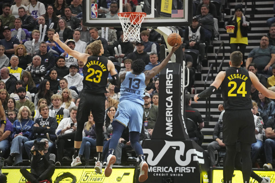 Memphis Grizzlies forward Jaren Jackson Jr. (13) goes to the basket as Utah Jazz forward Lauri Markkanen (23) defends during the first half of an NBA basketball game Wednesday, Nov. 1, 2023, in Salt Lake City. (AP Photo/Rick Bowmer)