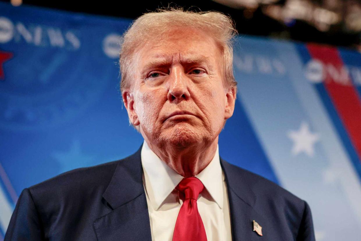 <p>Hannah Beier/Bloomberg via Getty </p> Donald Trump speaks to reporters in the spin room after his debate with Kamala Harris on Sept. 10, 2024