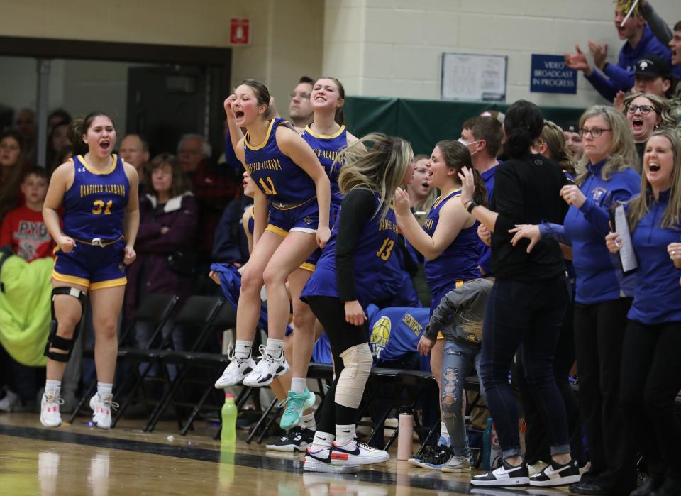 Oakfield-Alabama's bench jumps as a teammate makes a foul shot making a wider lead over Canisteo-Greenwood  who they defeated 49-45 in their Section V Class C1 championship game at Rush Henrietta High School.  