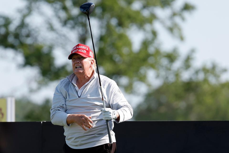 May 25, 2023; Washington, DC, USA; Former President Donald Trump hits his tee shot on the first hole during the Pro-Am tournament as part of the LIV Golf Washington D.C. 2023 event at Trump National Golf Club outside Washington DC. on May 25, 2023.