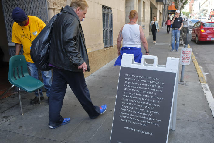 FILE - In this Aug. 29, 2018, file photo, words from Mayor London Breed are displayed outside the entrance to Safer Inside, a realistic model of a safe injection site in the Tenderloin neighborhood of San Francisco. Seventeen federal law enforcement agencies are teaming up for a year-long crackdown on a notorious area of San Francisco where open drug use has been tolerated for years. U.S. Attorney David Anderson said Wednesday, Aug. 7, 2019, that the federal government is targeting the city's Tenderloin neighborhood with arrests of drug traffickers as the first step in cleaning up a roughly 50-block area he says is "smothered by lawlessness." (AP Photo/Eric Risberg, File)
