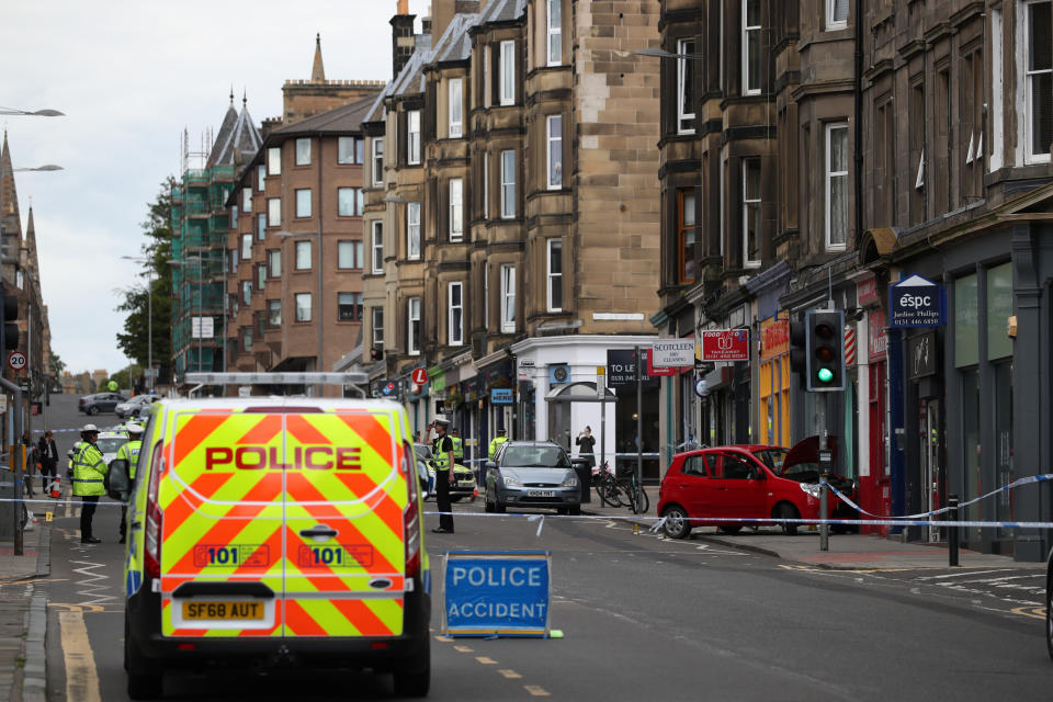 Police at the scene of the crash on Morningside Road, Edinburgh, on 30 June. (PA)