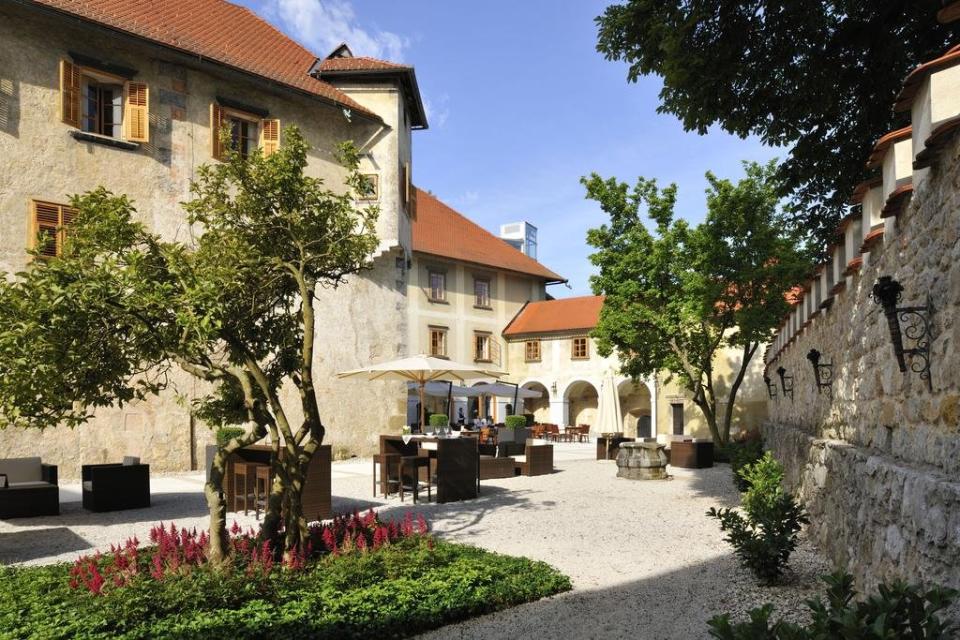 Relais & Chateaux Otočec Castle Hotel outdoor seating area, Slovenia