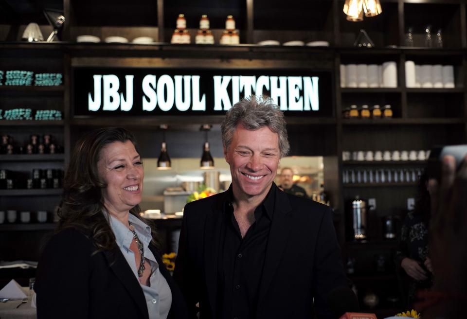 Jon Bon Jovi and his wife Dorothea smile after opening the BEAT centre in Toms River, New Jersey, on May 10, 2016. The Food Bank of Monmouth and Ocean Counties, Jon Bon Jovi Soul Foundation and Peoples Pantry announced the opening of BEAT, a place where families and individuals can access food, job training and resources to help end the cyclical causes of hunger. (AFP / Jewel SAMAD via Getty Images)