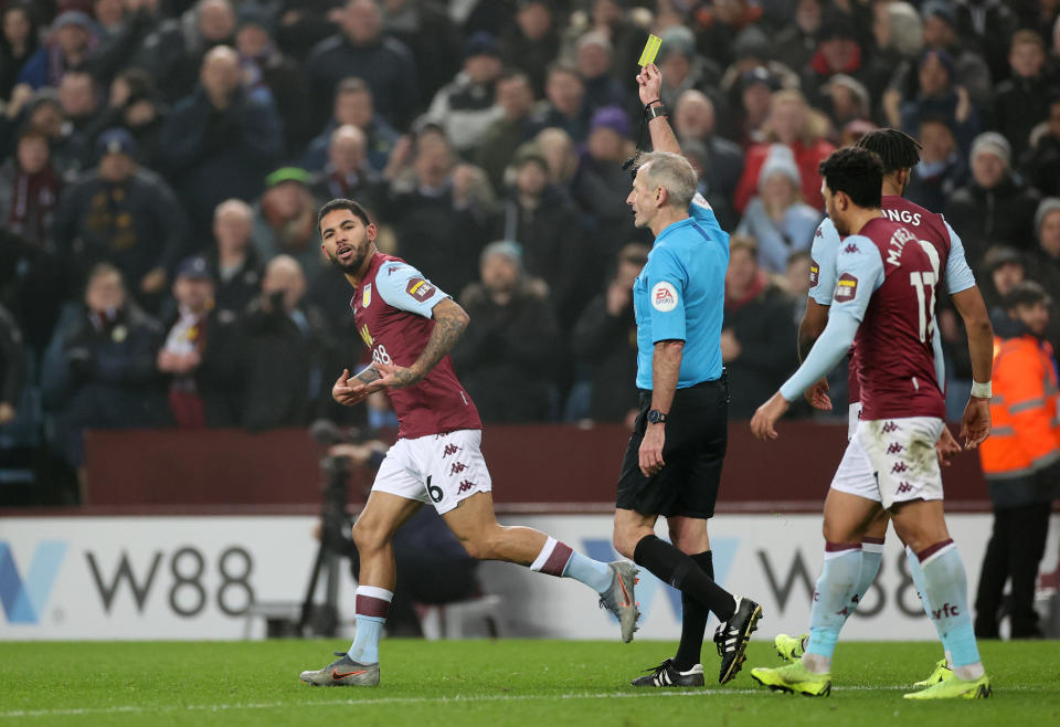 Aston Villa's Douglas Luiz is shown a yellow card for excessive celebration following his goal against Watford. (Reuters/Carl Recine)