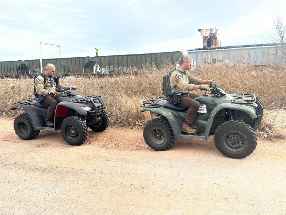 Members of the Oklahoma Highway Patrol help with the search of a missing 4-year-old Cyril girl on Wednesday.