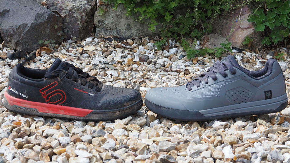  Two MTB flat shoes facing each other outdoors. 