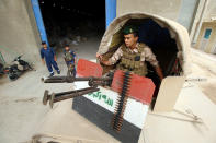 <p>Elements of the Iraqi army and police stand guard at a warehouse of Iraqi’s Independent High Electoral Commission in Basra, Iraq May 3, 2018. (Photo: Essam al-Sudani/Reuters) </p>